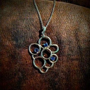 Mid chest length gold tone and purple 💜 crystal pendant necklace